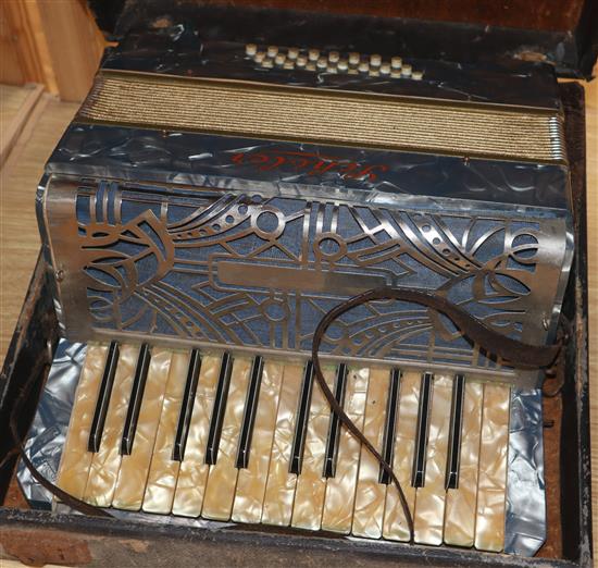 An early 20th century violin with fake label and an Italian piano accordian